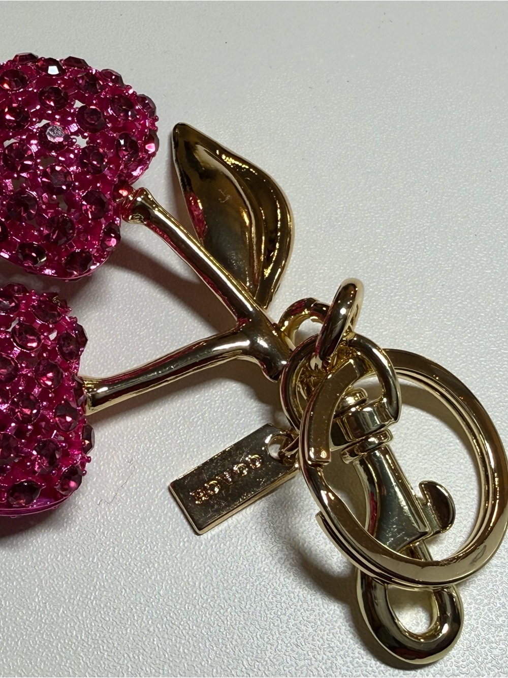Coach Pink Crystal Cherry Key Ring with Gold Hardware